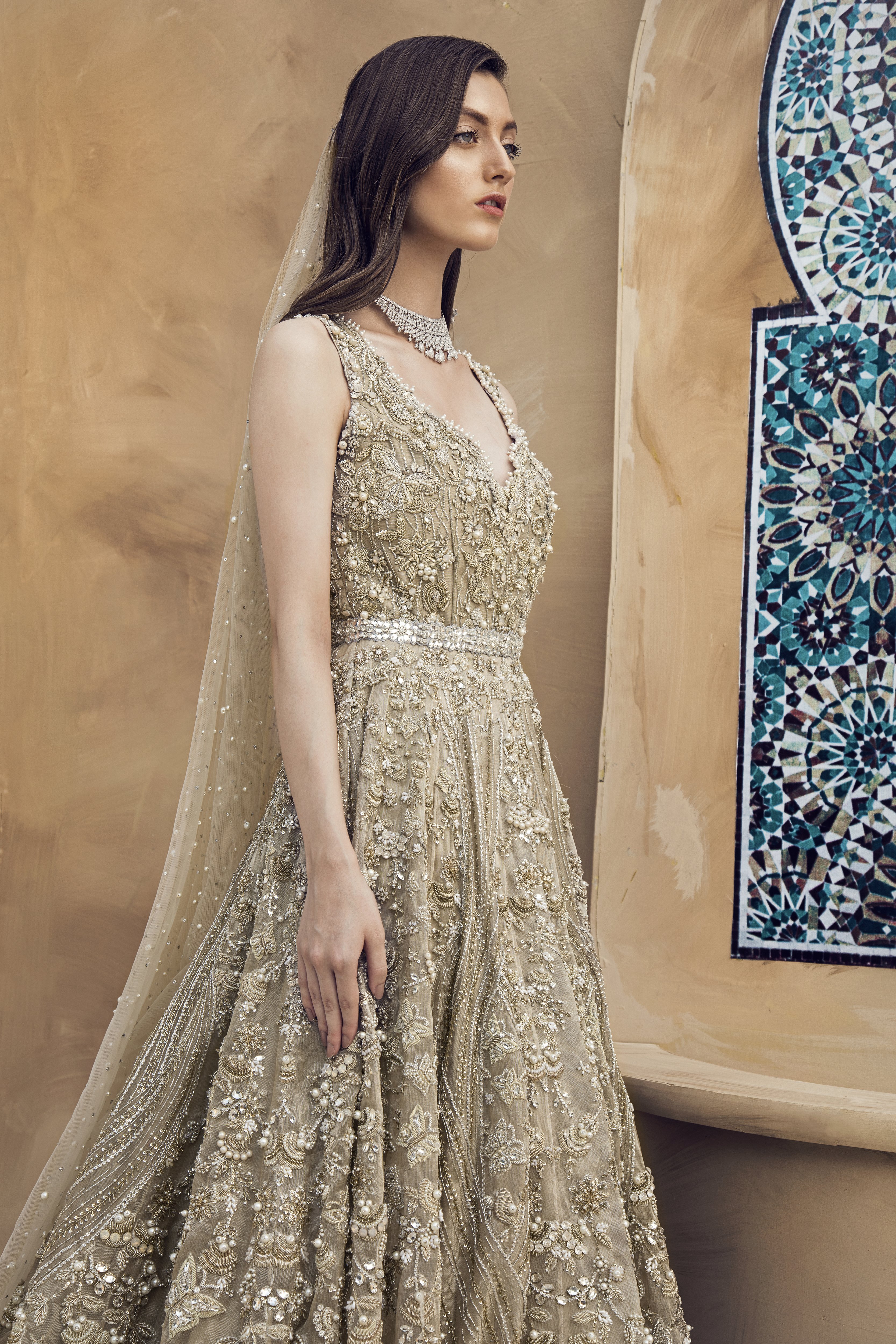 Silver color beautiful heavily embroidered frock by Pakistani fashion designers collection