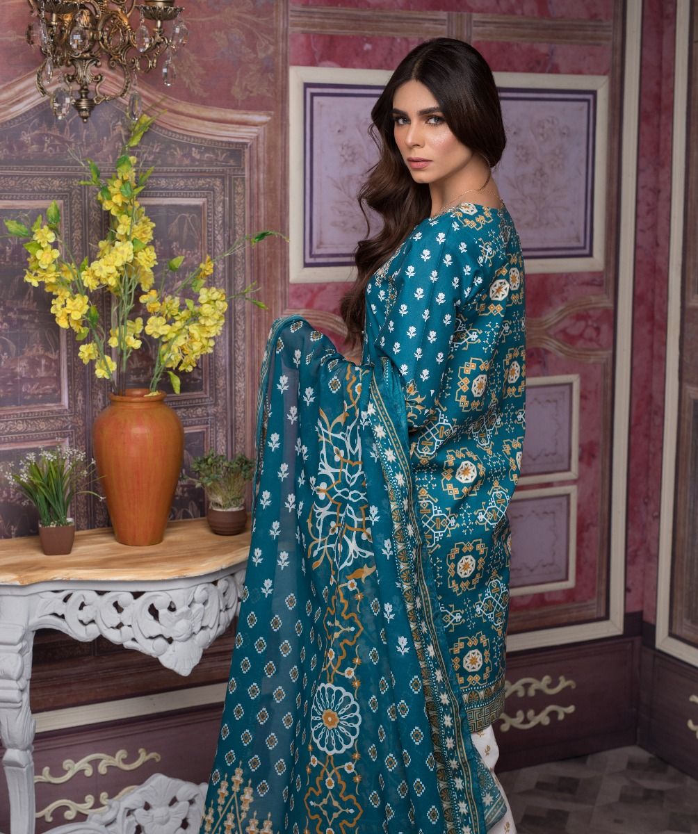 This blue embroidered 3 piece stitched dress is available online by Zeen women embroidered clothes collection 2019