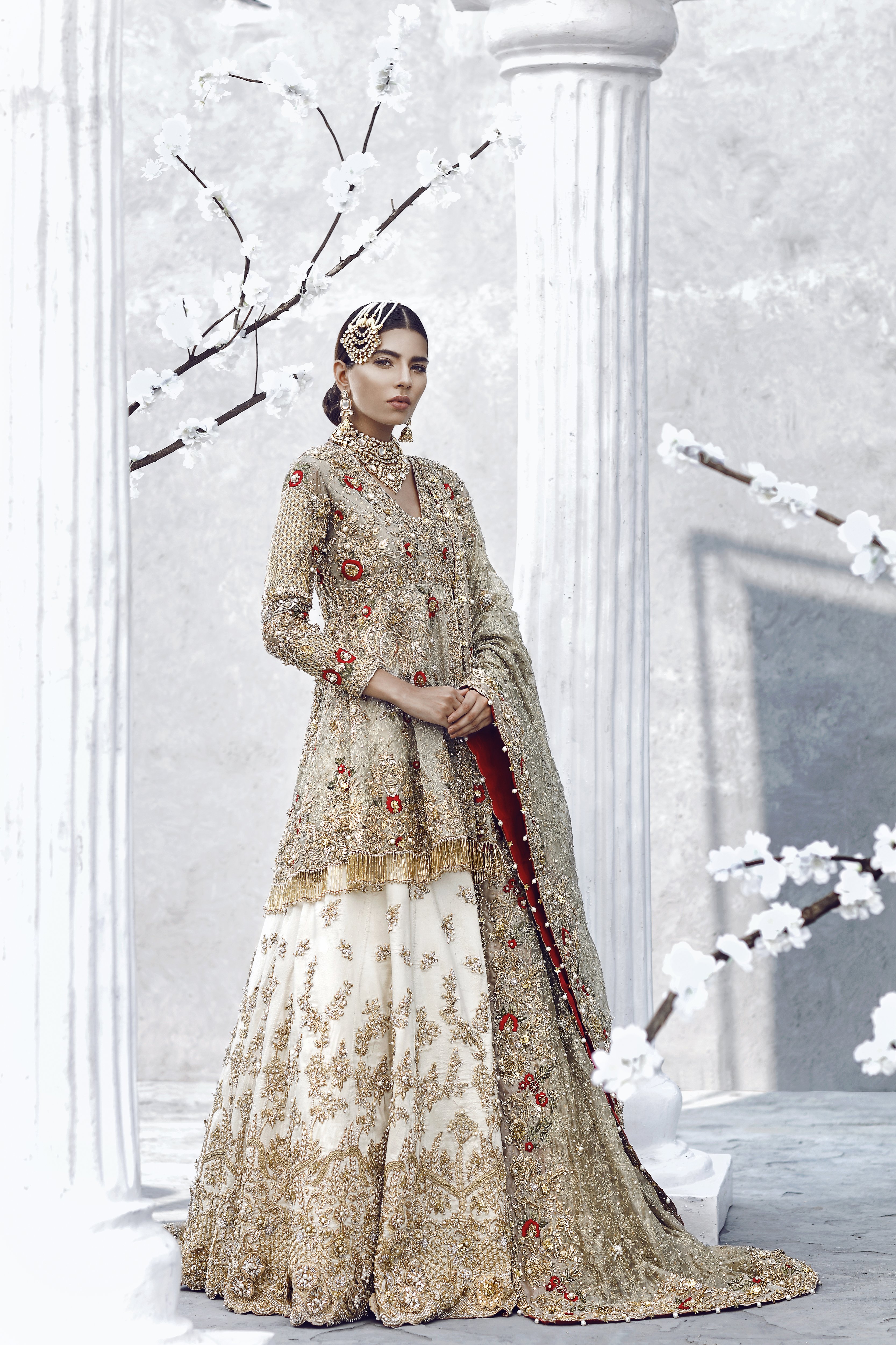 This elegant hand worked Pakistani wedding wear dress by renowed Pakistani fashion designer Asian wedding dresses online