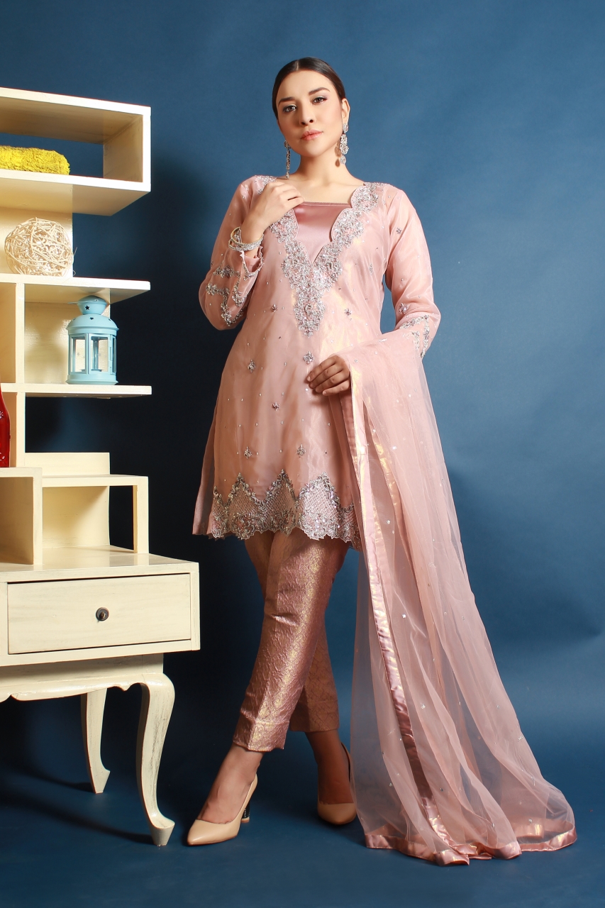 A salmon pink Pakistani party dress with embellished and embroidered shirt is your perfect choice