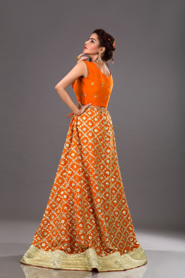 Buy this beautiful raw silk lehanga in orange color by Sanober Azfer Pakistani wedding dresses at a best price