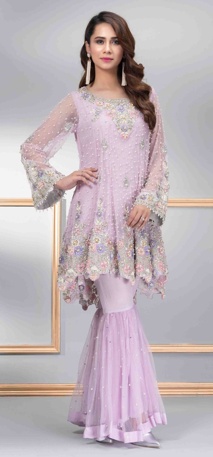 A beautiful and vibrant lavender colored two piece Pakistani party dress