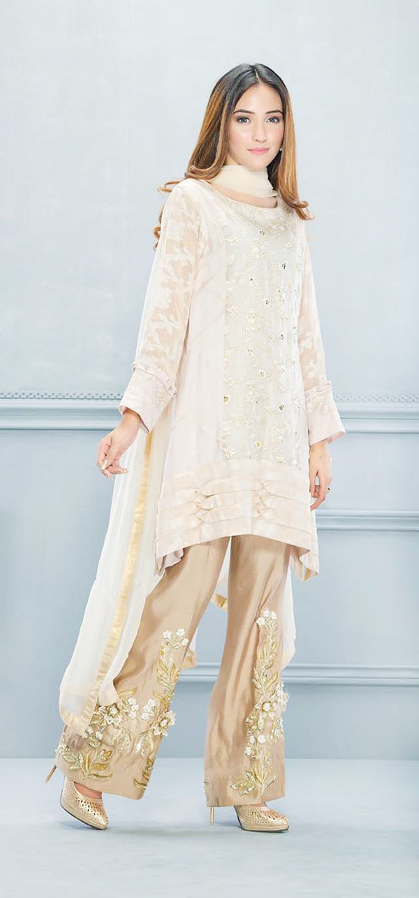 Beautiful beige colored three piece Pakistani party dress with embroidery