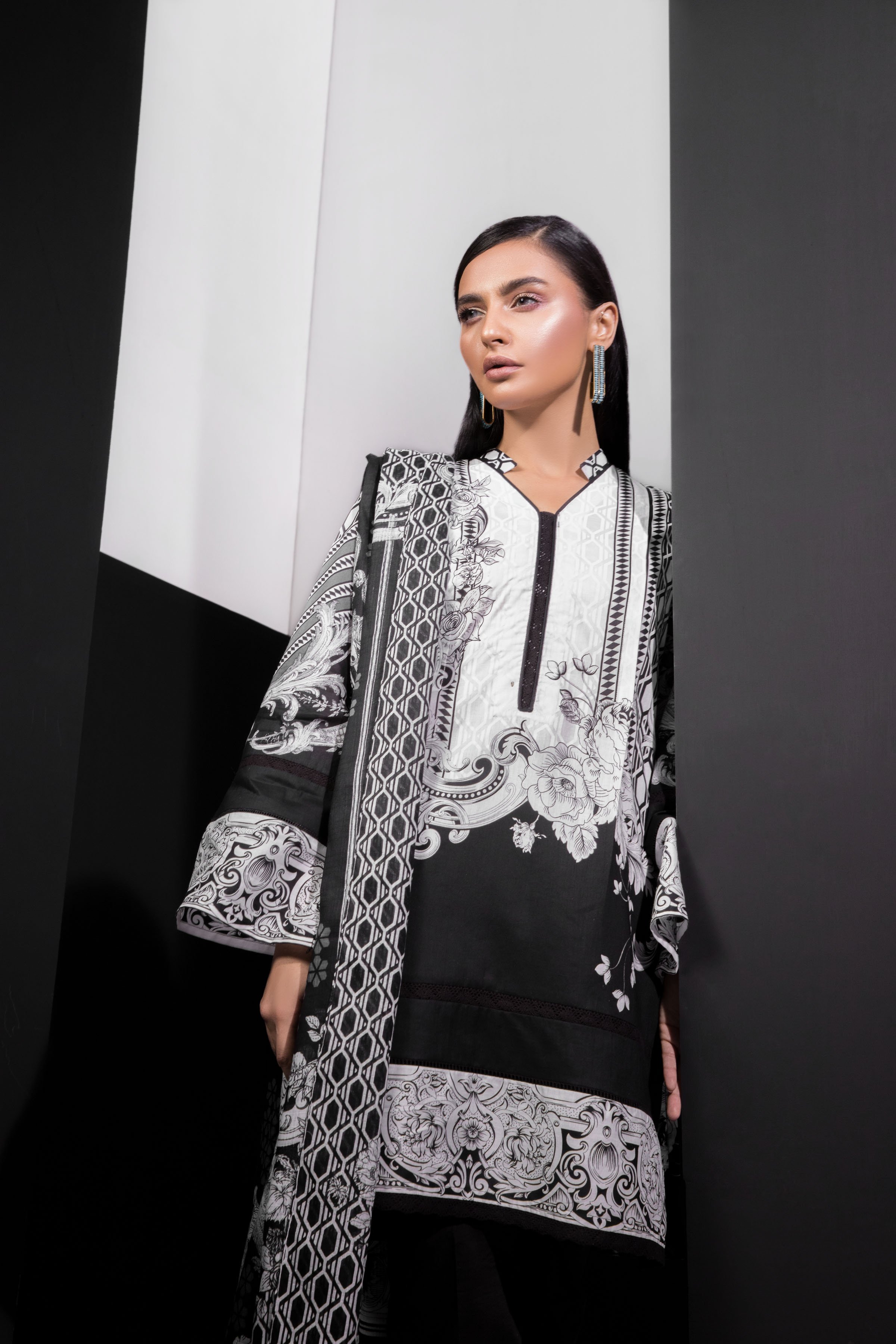 Buy a beautiful and elegant black and white unstitched Pakistani suit by Sapphire