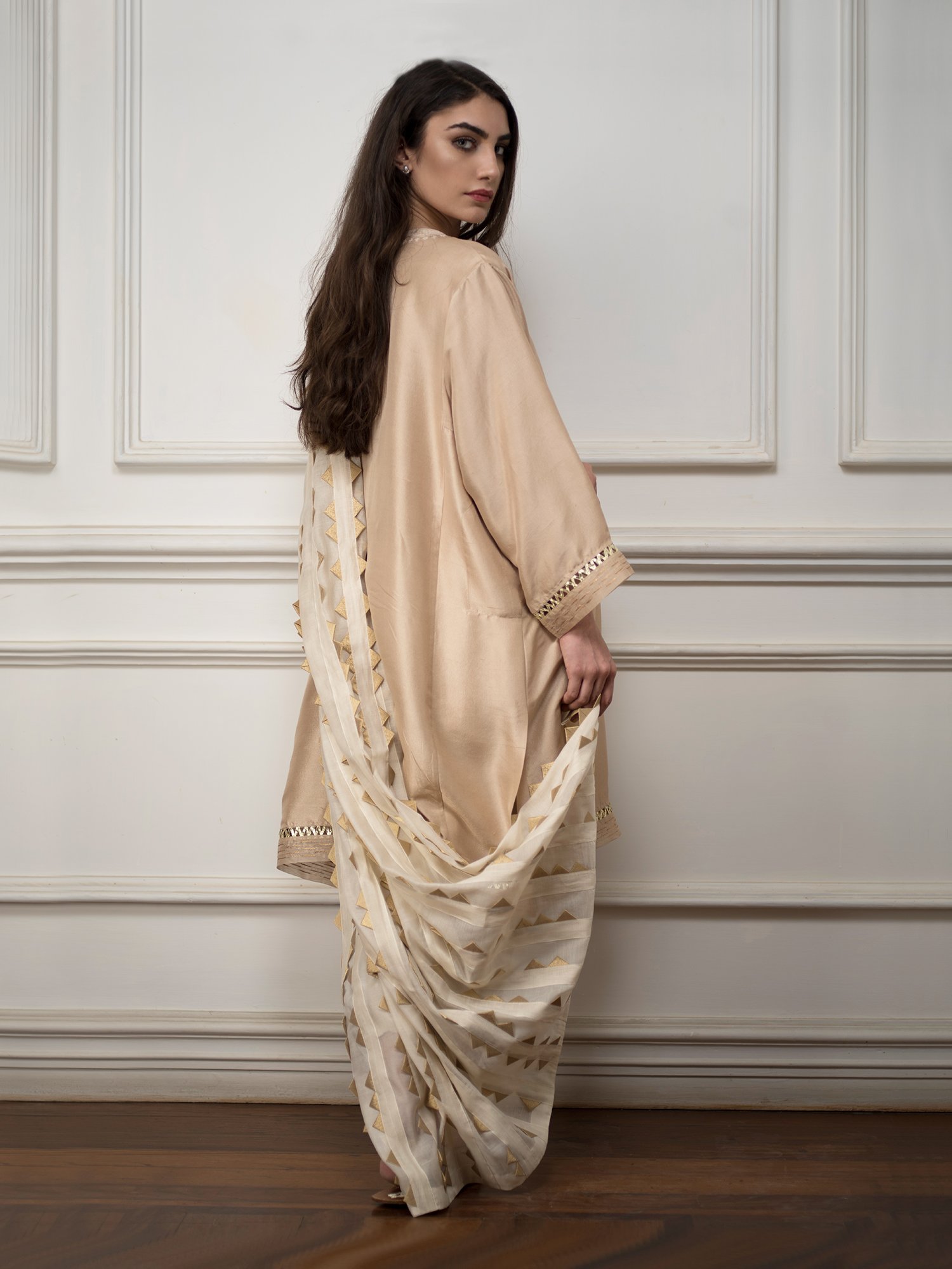 Our Nimr kurti is a relaxed style, cut from weightless silk and handcrafted using traditional embroidery