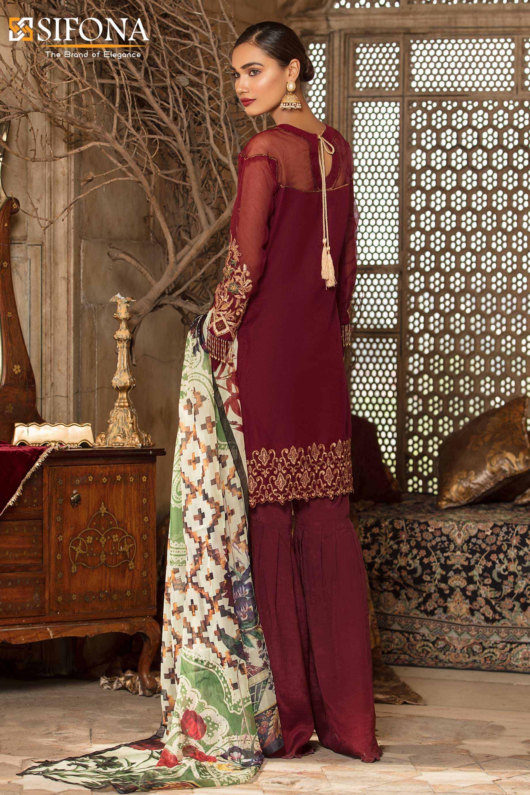 This elegant Pakistani maroon Pakistani net suit by Sifona