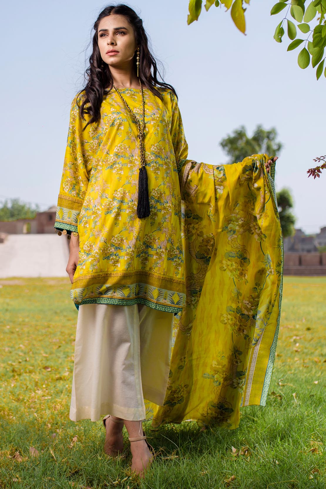 This pretty dress in yellow by Warda saleem has lawn fabric