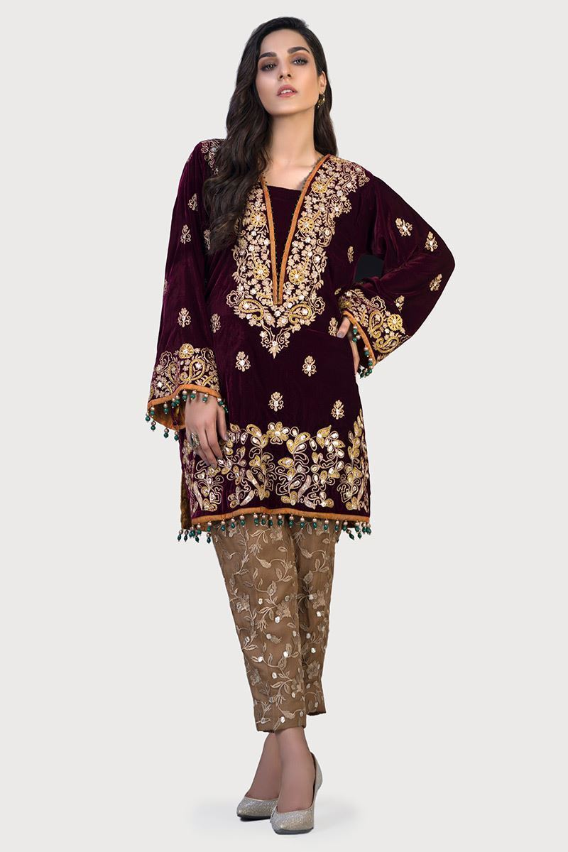 A very traditional plum Velvet shirt embroidered with Gota work.