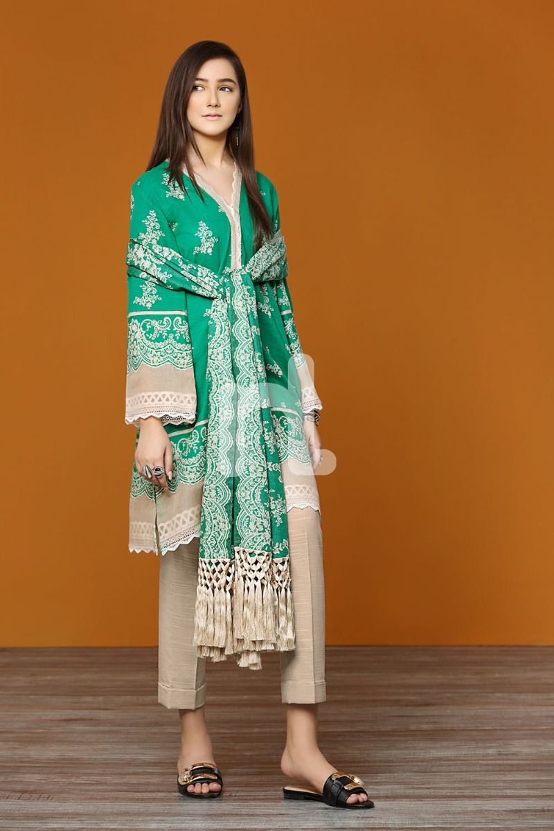 A vibrant green beautifully dress by Nishat linen