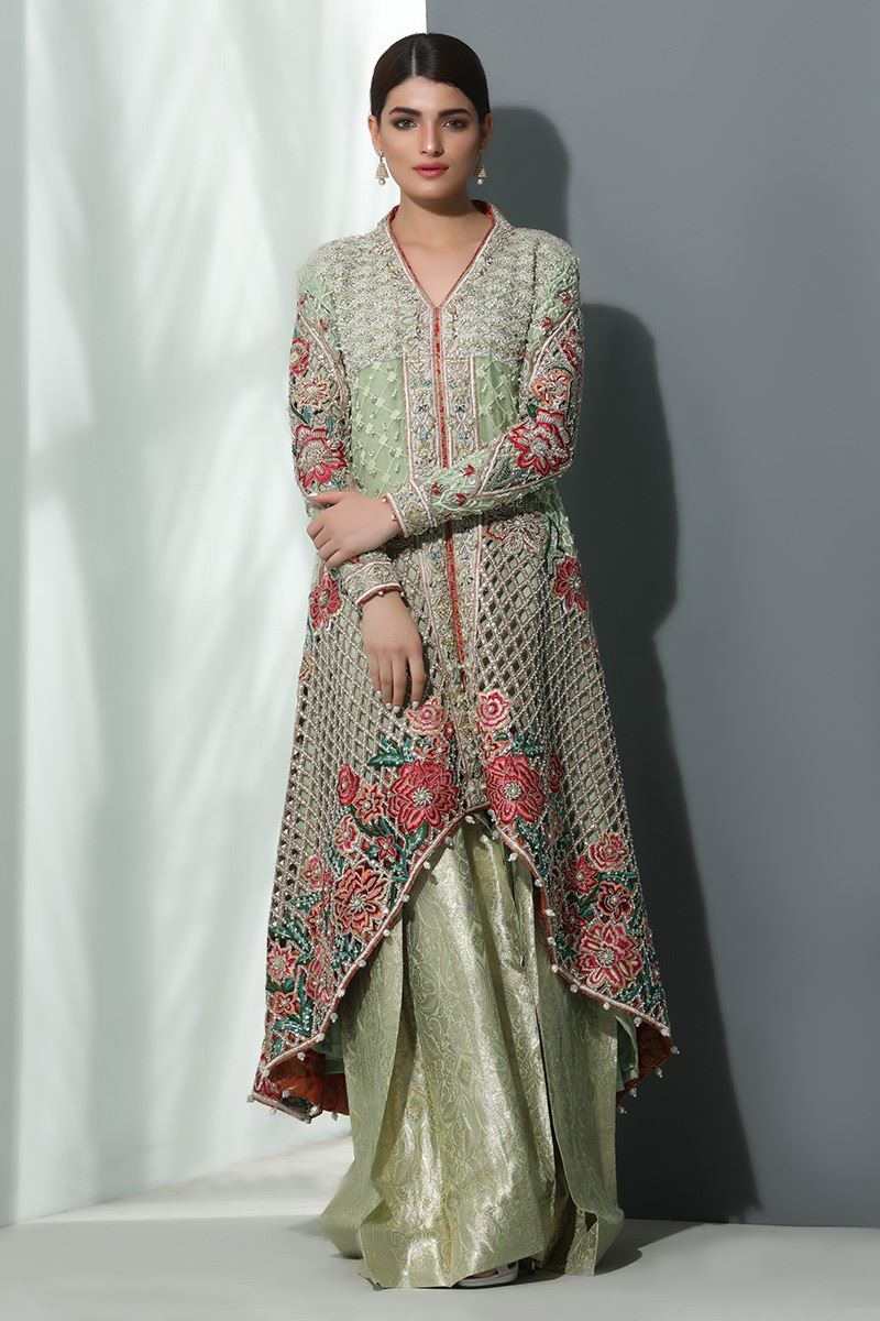 This Pakistani wedding dress by Annus Abrar has long closed end tailed shirt
